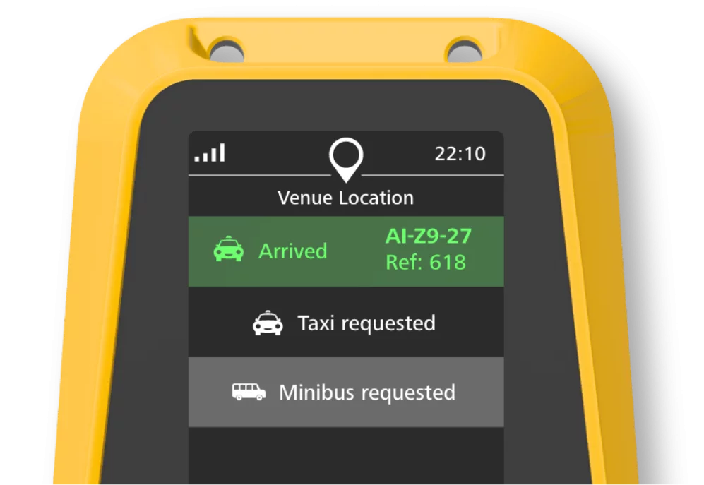 Hotel staff clicking the Taxi Butler ONE taxi booking device to book a minibus