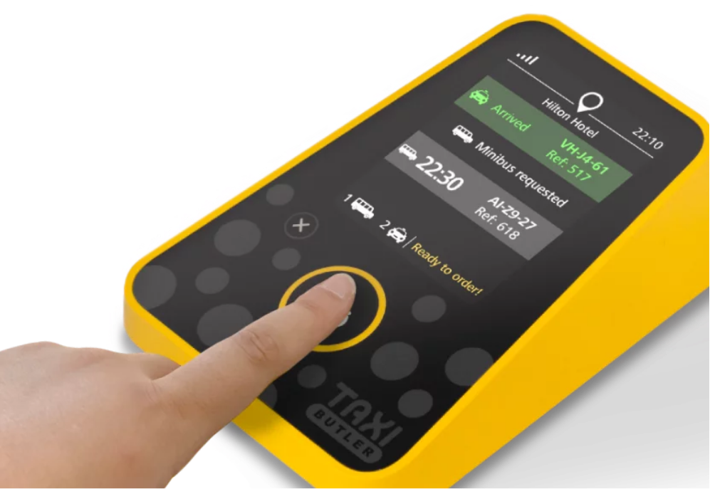 Hotel staff  clicking the purpose-built Taxi Butler ONE taxi booking device