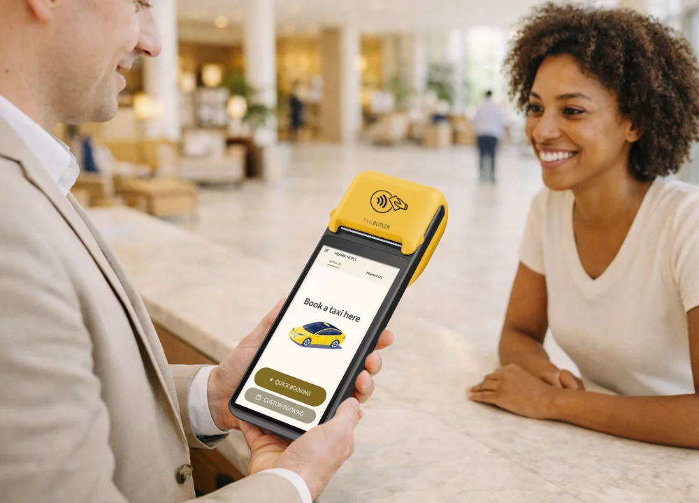 Hotel administrator booking a taxi with Taxi Butler Plus device